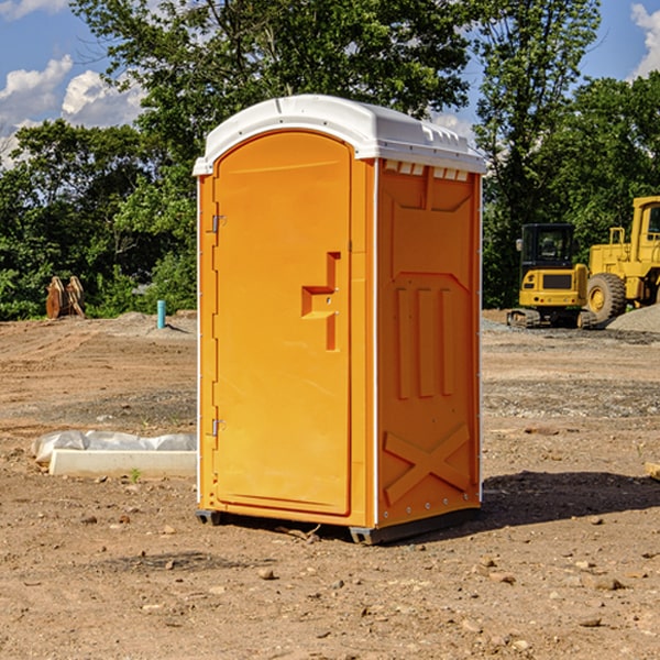 what is the cost difference between standard and deluxe portable toilet rentals in Highland NE